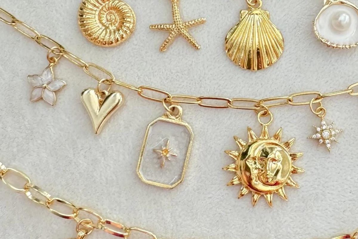 Sun, moon and star charms on a paperclip chain